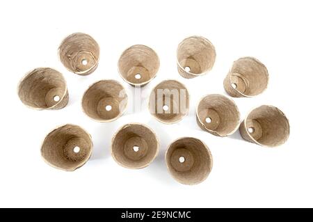Horizontal shot looking down on twelve empty peat pots ready for Spring planting. Stock Photo