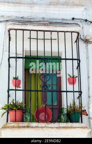Vejer de la Frontera, Cadiz, Spain. Typical village of Andalusia. Window decorated with flower pots Stock Photo