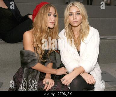 US actresses Mary Kate L and Ashley Olsen sit front row at the