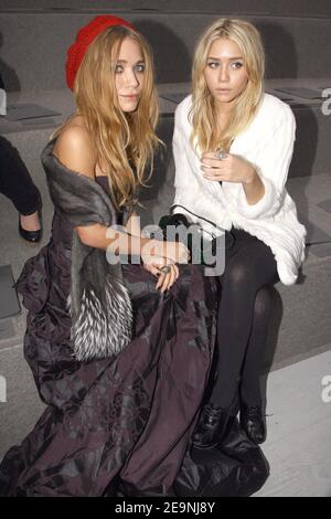 US actresses Mary Kate L and Ashley Olsen sit front row at the