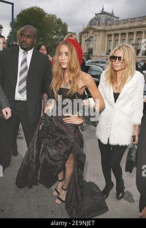 US actresses Mary-Kate and Ashley Olsen arrive at the presentation of the Dior Spring-Summer 2007 Ready-to-Wear collection by British designer John Galliano, in the Grand Palais in Paris, France on October 3, 2006. Photo by Gaetan Mabire/ABACAPRESS.COM Stock Photo