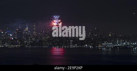 Panoramic night view of July Fourth fireworks shot from Empire State Building during 2020 coronavirus pandemic. Stock Photo