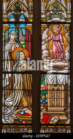 TRNAVA, SLOVAKIA - OCTOBER 14, 2014: The holy Therese on the stained glass in St. Nicholas church. Stock Photo