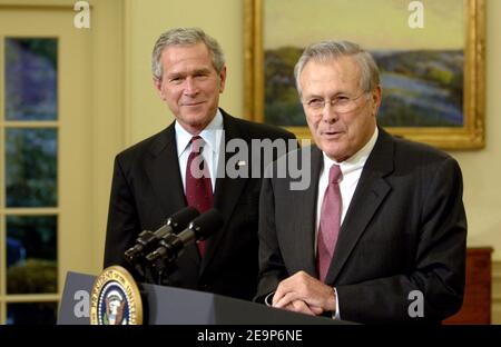 President George W. Bush looks on as Secretary of Defense Donald Rumsfeld addresses the nation during a news conference broadcasted from the East Room of the White House in Washington DC, USA onNovember 8, 2006. Photo DOD via ABACAPRESS.COM Stock Photo
