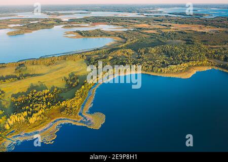 Braslaw Or Braslau, Vitebsk Voblast, Belarus. Aerial View Of Nedrava Lake And Green Forest Landscape In Sunny Autumn Morning. Top View Of Beautiful Stock Photo