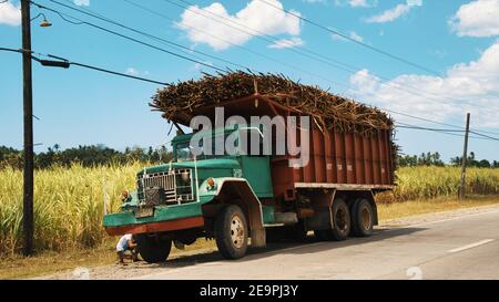 The sugar cane truck broke down on the road next to the sugar cain field in the philippines, sugar cane truck Stock Photo