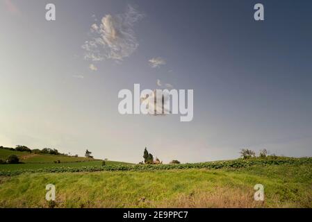 House in the middle of the farm with sky blue and big cloud Stock Photo