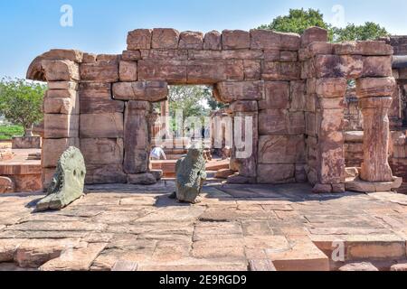 Bagalakote, Karnataka, India .Pattadakal temple complex. Brown stone Mallikarjuna Temple entrance on platform with back of black Nandi statue under bl Stock Photo