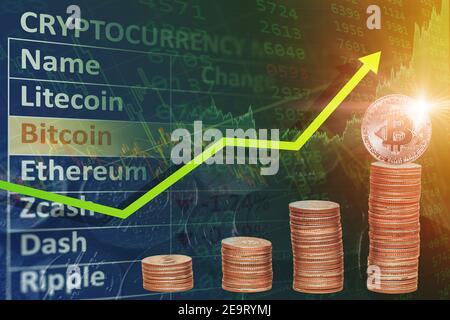 Bitcoin trading price rising new high concept,BTC coin stacked overlay with chart up arrow for cryptocurrency market news. Stock Photo