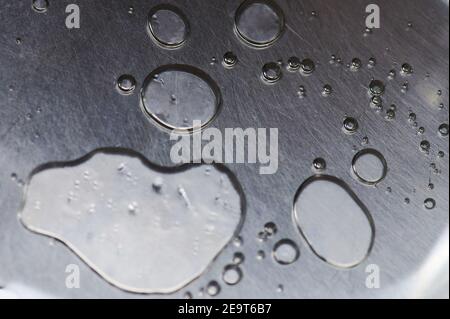 Water drops on metal surface macro close up view Stock Photo