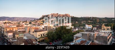 Looking across the Athena Athens cityscape in Greece at the Acropolis at sunset Stock Photo