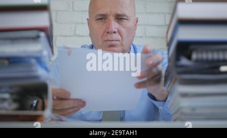 Image with a Businessman Working in Accounting Archive Room. Manager Working in Ofiice with Documents. Stock Photo