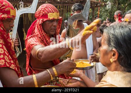 Payyanur, India - December 6, 2019: Velichappadu, the Oracles of Kerala during traditional religious village ceremony, South India Stock Photo