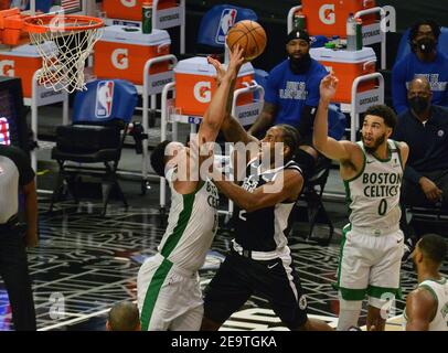 Boston Celtics' power forward Grant Williams fouls Los Angeles Clippers' forward Kawhi Leonard during the third quarter at Staples Center in Los Angeles on Friday, February 5, 2021. The Celtics defeated the Clippers 119-115.  Photo by Jim Ruymen/UPI Stock Photo