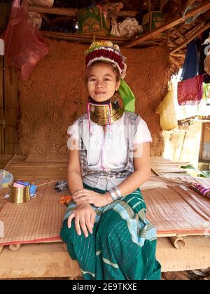 Portrait of a beautiful woman from the Karen hill tribe wearing their signature jewellery around her long neck Stock Photo