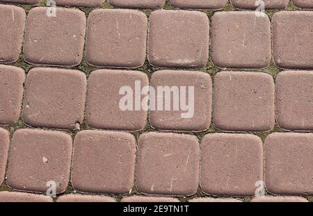 Texture of street outdoor square tiles in red. Stock Photo