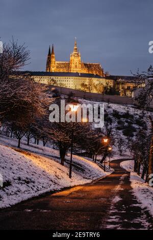 Postcard view of evening Prague Castle from Petrin, Czech republic.Famous tourist destination.Prague winter panorama.Snowy day in the city. Stock Photo
