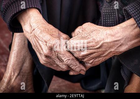 Dramatic hands of an old unidentified person Stock Photo