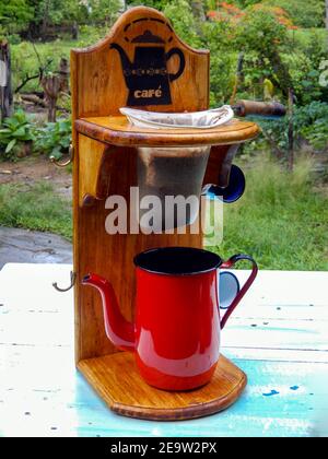 Red coffee maker and cloth filter, red teapot. rustic coffee Stock Photo