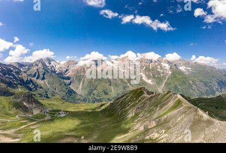 Aerial drone view of Grossglockner mountain range with serpentine high alpine road in Austria Stock Photo