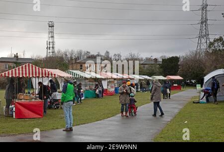 Portobello, Edinburgh, Scotland, UK. 6th February 2021. Dreary and Cool at below 4 degrees for those attending the Market in Brighton Place where traders are currently only permitted to sell food and drink produce due to Covid-19 restrictions. Stock Photo