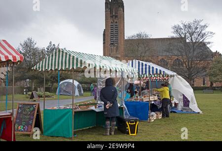 Portobello, Edinburgh, Scotland, UK. 6th February 2021. Dreary and Cool at below 4 degrees for those attending the Market in Brighton Place where traders are currently only permitted to sell food and drink produce due to Covid-19 restrictions. Stock Photo