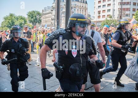 PARIS, FRANCE - JUNE 29, 2019: CRS riot police control the crowds at the 33rd Gilets Juanes (yellow vest) protests in Paris. Stock Photo