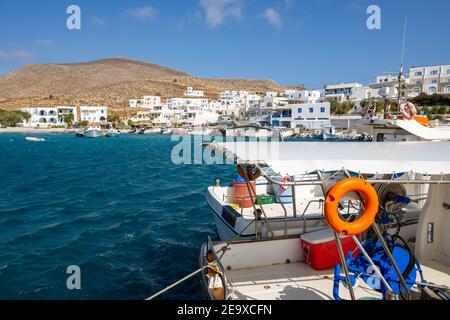 Karavostasi, the port of Folegandros, with whitewashed houses and pastel coloured fishing boats. Cyclades, Greece Stock Photo