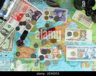 Map of Europe, political or general geology with traveler's items, banknotes and coins of various European countries. Stock Photo