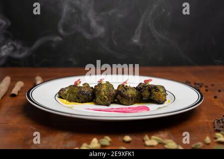 Chicken skew Kebab.Traditional Indian dish cooked on charcoal and flame. Stock Photo