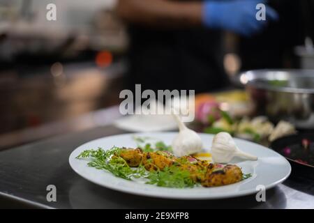 Chicken skew Kebab.Traditional Indian dish cooked on charcoal and flame. Stock Photo