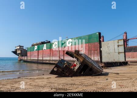 Ship being broken up at Gadani ship-breaking yard, located across a 10 km long beachfront, Balochistan, Pakistan. Stock Photo