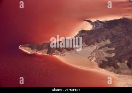 Picturesque view of pink lake, Aerial view of coastline of exotic pink salt Urmia lake with cliff formation, Iran Stock Photo