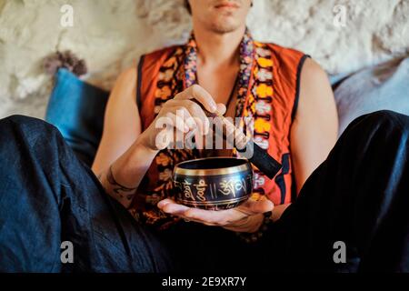 Anonymous man practicing meditation at home Stock Photo