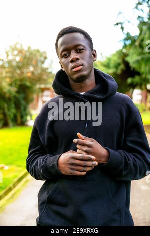 Young African American man in casual clothes looking at the camera. Stock Photo