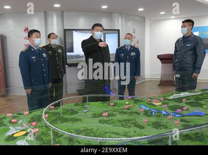 (210206) -- GUIYANG, Feb. 6, 2021 (Xinhua) -- Chinese President Xi Jinping, also general secretary of the Communist Party of China (CPC) Central Committee and chairman of the Central Military Commission (CMC), learns about the education and training of soldiers and officers on Feb. 4, 2021. Xi on Thursday inspected an aviation division of the Air Force stationed in southwestern Guizhou Province ahead of the Spring Festival, or the Chinese Lunar New Year. Xi extended New Year greetings to all soldiers and officers of the People's Liberation Army, armed police force, civilian personnel in the Stock Photo