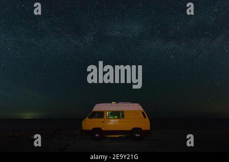 Camper van under starry sky Stock Photo - Alamy