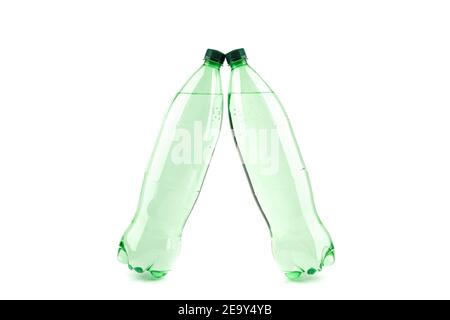 Two plastic transparent bottles with mineral water on a white background. Copy space. Stock Photo