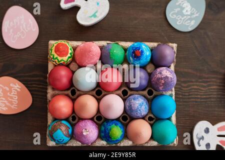 High angle view of colorful handmade easter eggs on the wooden table Stock Photo
