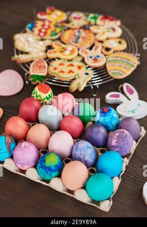 Close-up of Easter eggs and gingerbread cookies on the table prepared for Easter holiday Stock Photo