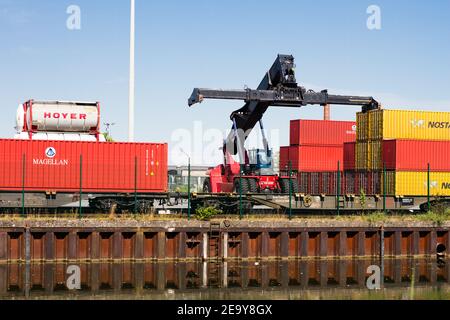 Container port with a big fork lifter Stock Photo