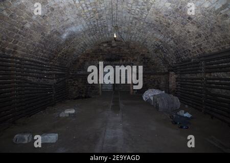 Abandoned old wine cellar is made from a limestone. Wine cellar of the Republic of Moldova. Stock Photo