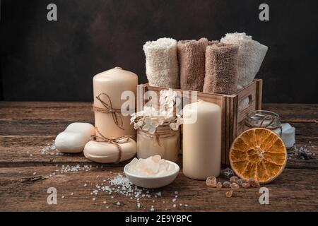 Spa composition with body care items on a brown background. Stock Photo