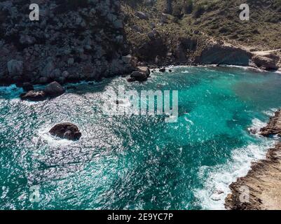 Drone view of beautiful blue water and mountains, with a great view of  mediterranean landscape in Cala Murta, Mallorca, Europe, Spain. Stock Photo