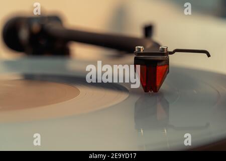 Close-up of Vinyl Record and Turntable Sound Pick-up With Needle Stock Photo