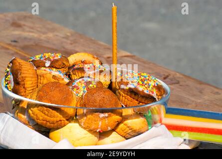 Easter eggs and cakes on lighting near the temple. Stock Photo