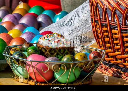 Easter eggs and cakes on lighting near the temple. Stock Photo