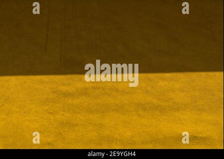 Velvet texture of seamless leather. Felt material macro. Yellow suede texture. leather Yellow Stock Photo