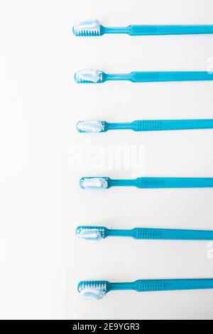 Plastic blue toothbrushes with toothpaste isolated on a white background Stock Photo