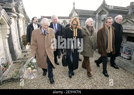 (L-R) Former Foreign Minister Roland Dumas, former Mitterrand's cabinet director Gilles Menage, journalist Laure Adler, former YSL CEO Pierre Berge, conductor Georges-Francois Hirsch and former Foreign Minister Hubert Vedrine on their way to late French President Francois Mitterrand's grave in Jarnac, France, on January 8, 2005, on the occasion of the 9th anniversary of his death. Photo by Patrick Bernard/ABACA. Stock Photo